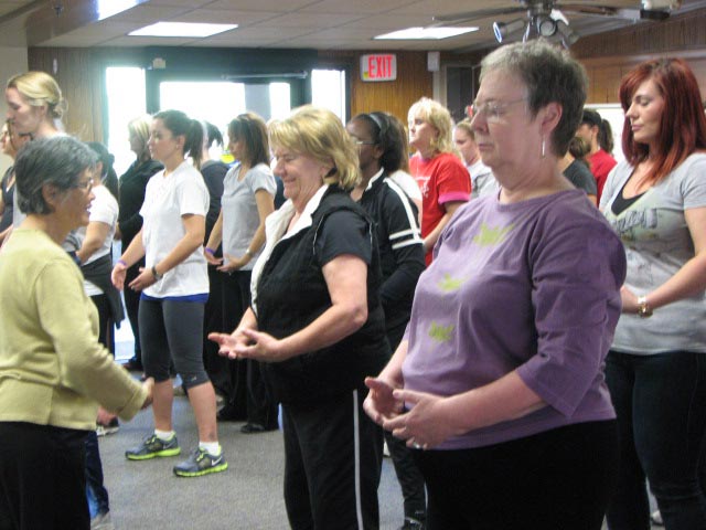 Employees learn Falun Gong Exercises