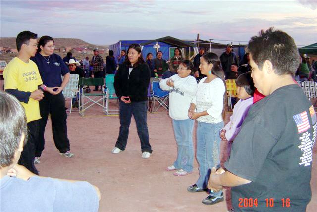 Volunteers sharing the practice at a community gathering