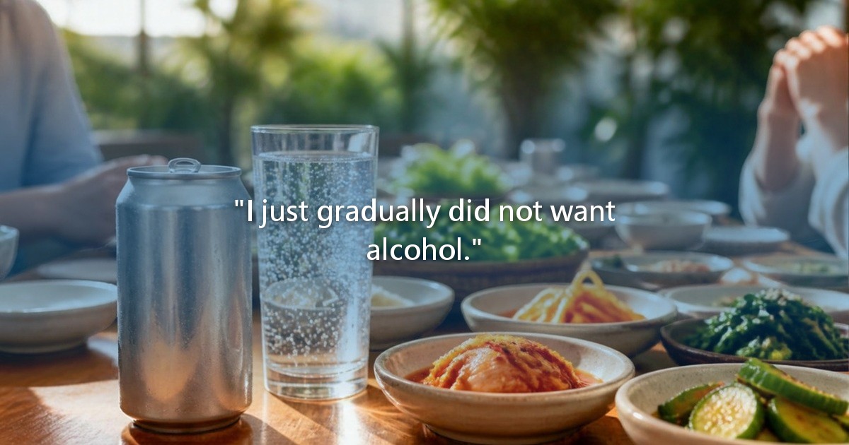 A can of soft drink and a glass of sparkling water among Korean side dishes at a bright company dinner.